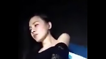 Young Chinese Woman Performs Striptease At Nightclub